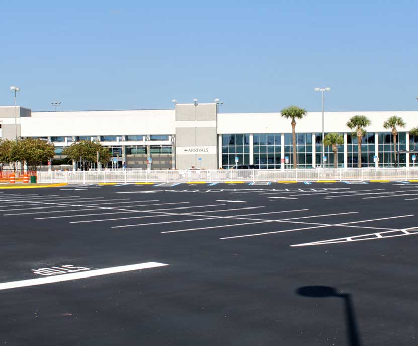 Blue ADA accessible parking space with fresh paint and stencil